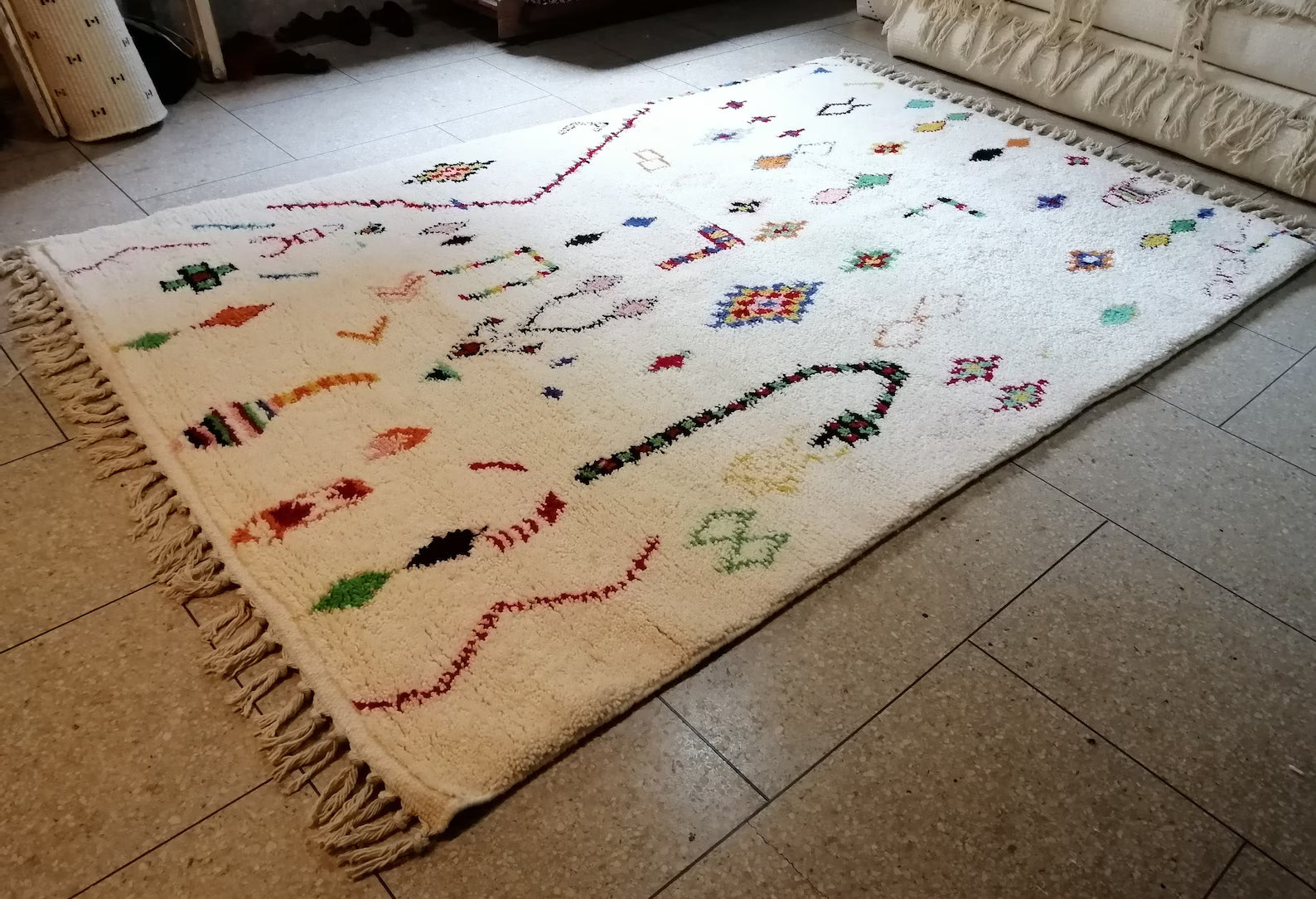 Artisan wool rug adding playful Moroccan character to a boho living room