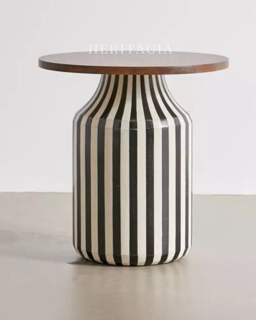 Black and white fiberglass side table with modern striped design