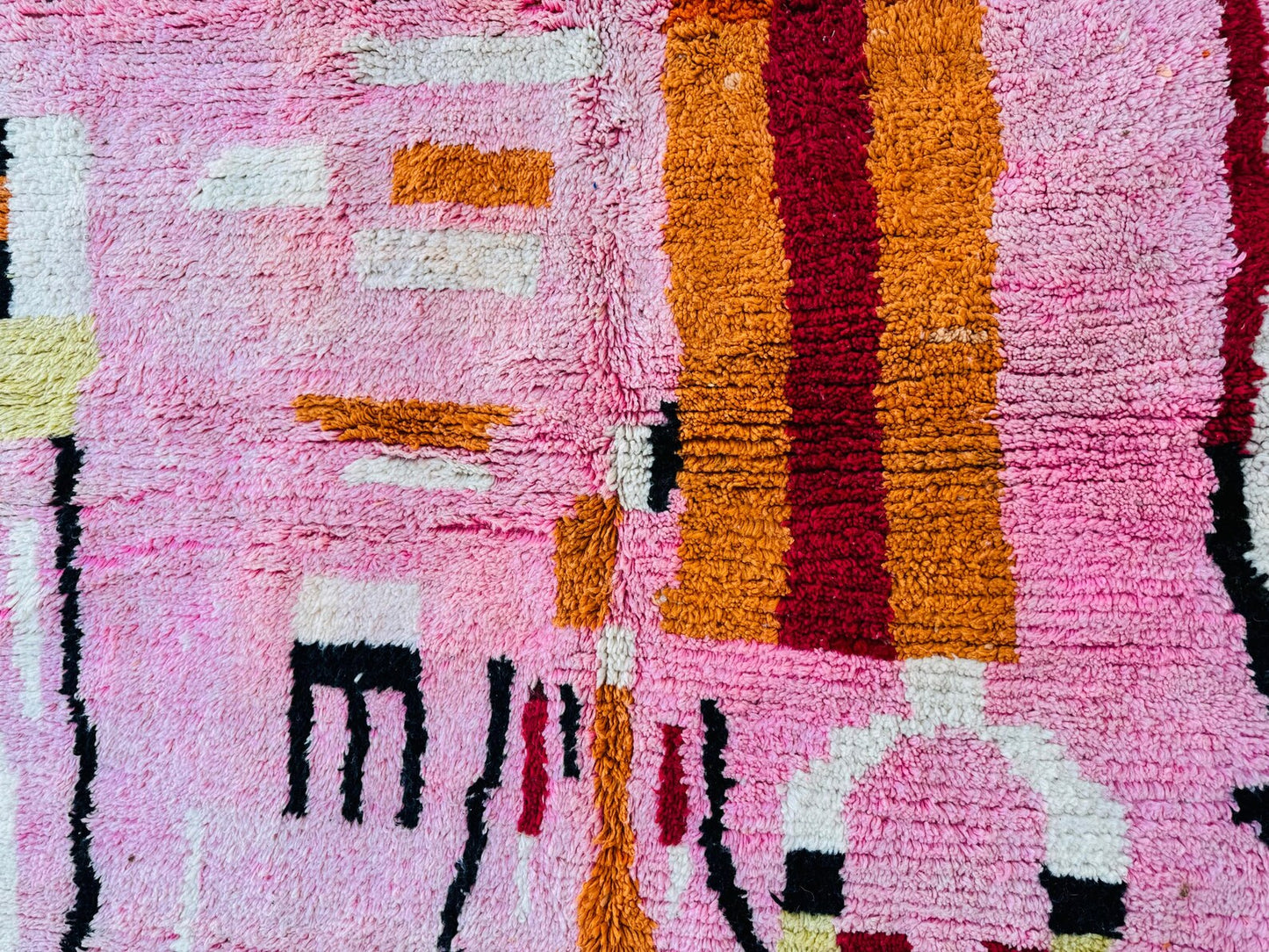 Colorful Moroccan rug with handcrafted tribal details and soft wool pile