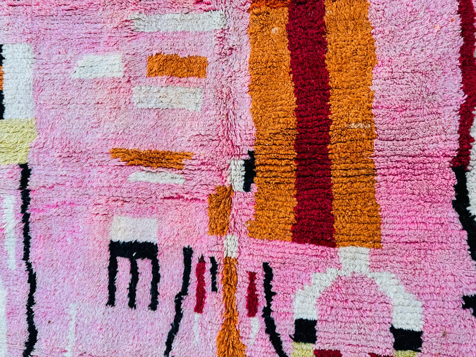 Colorful Moroccan rug with handcrafted tribal details and soft wool pile