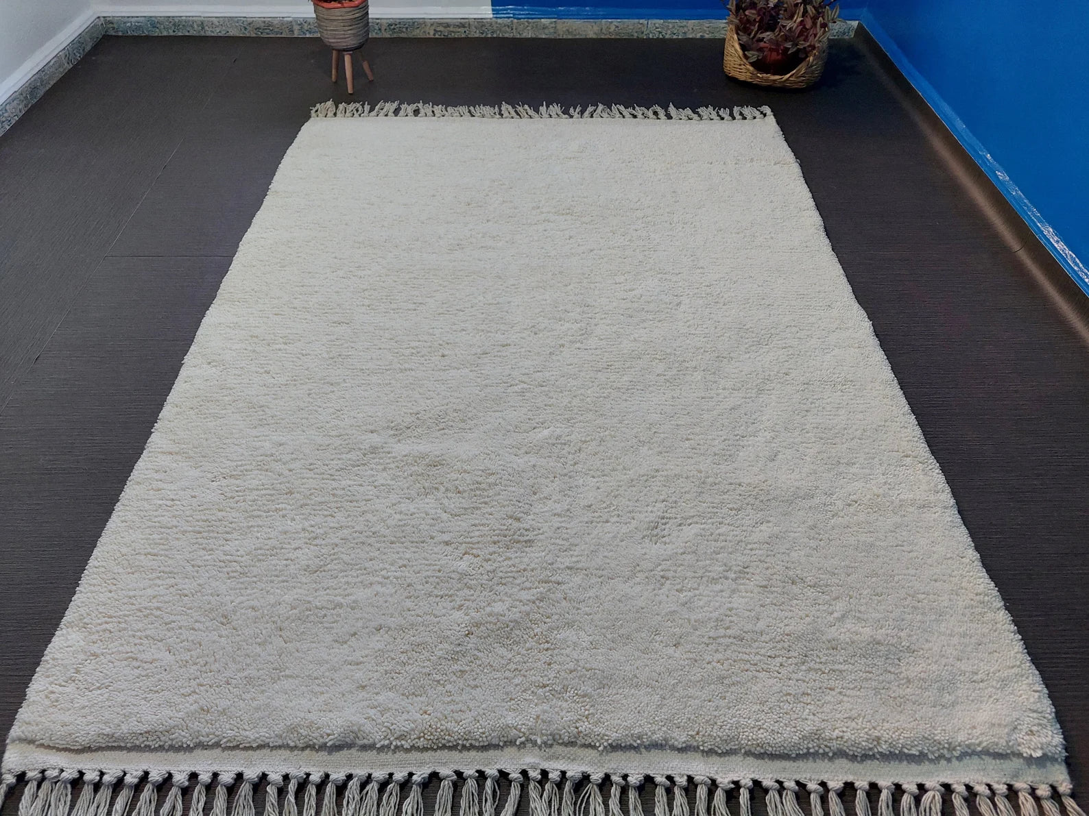 Custom size white Moroccan wool rug with handwoven texture and fringe edge