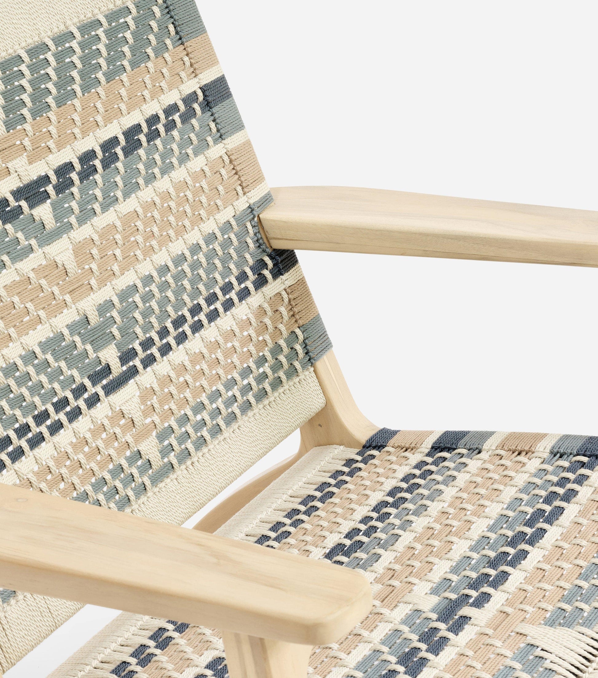 Handcrafted neutral armchair styled for a cozy reading corner 