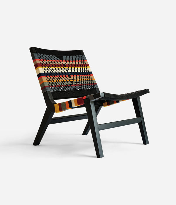 Handcrafted statement chair styled for a relaxed reading corner or lounge space