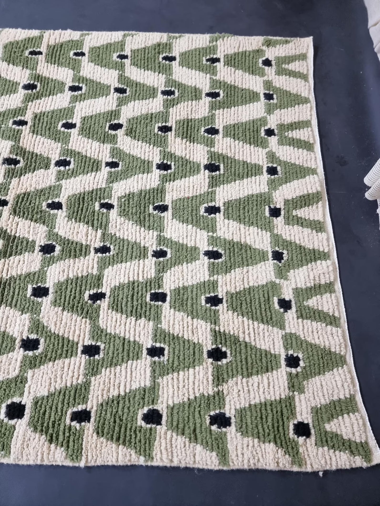 Handmade green Moroccan area rug styled for living room or bedroom