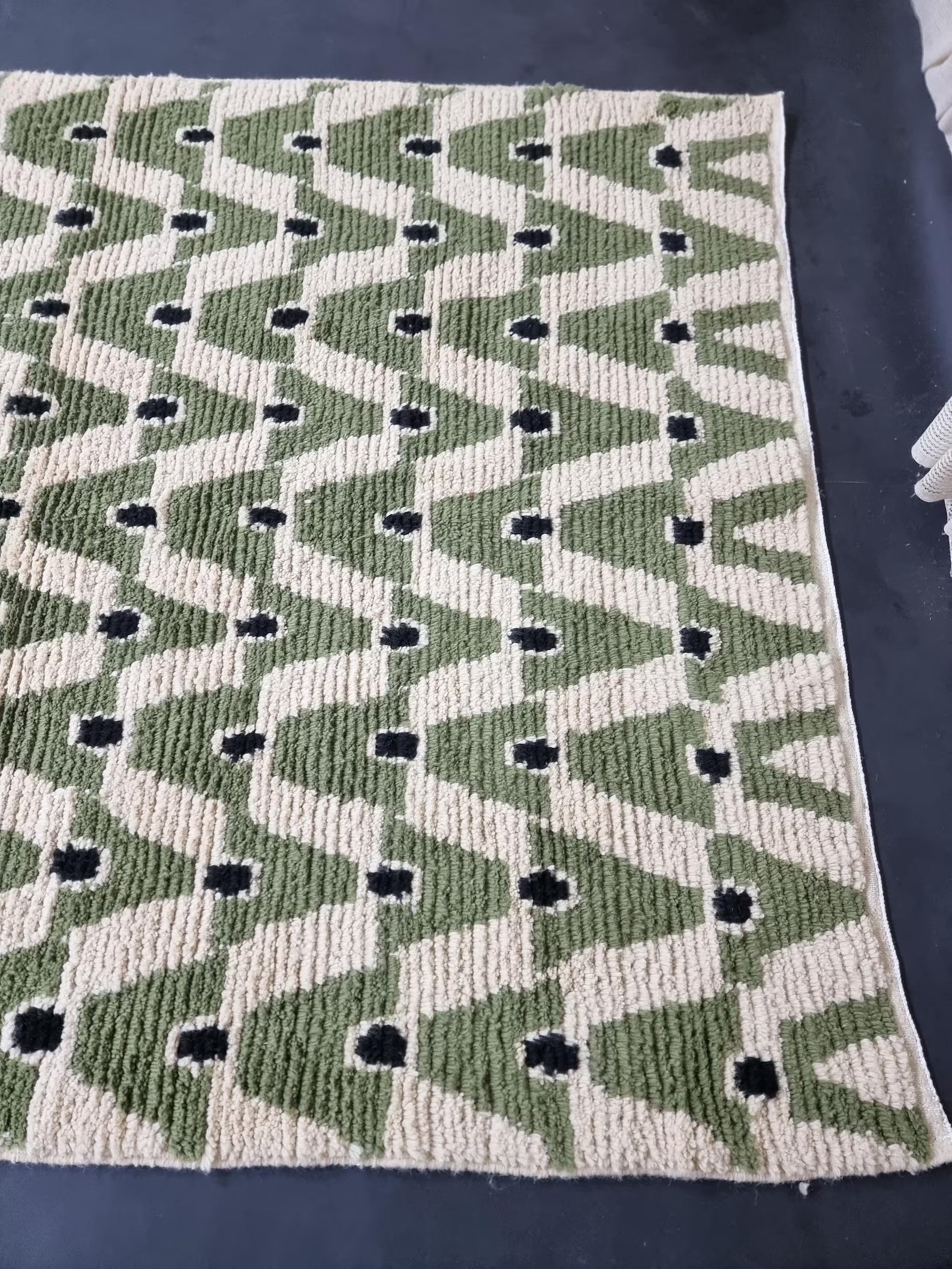 Handmade green Moroccan area rug styled for living room or bedroom