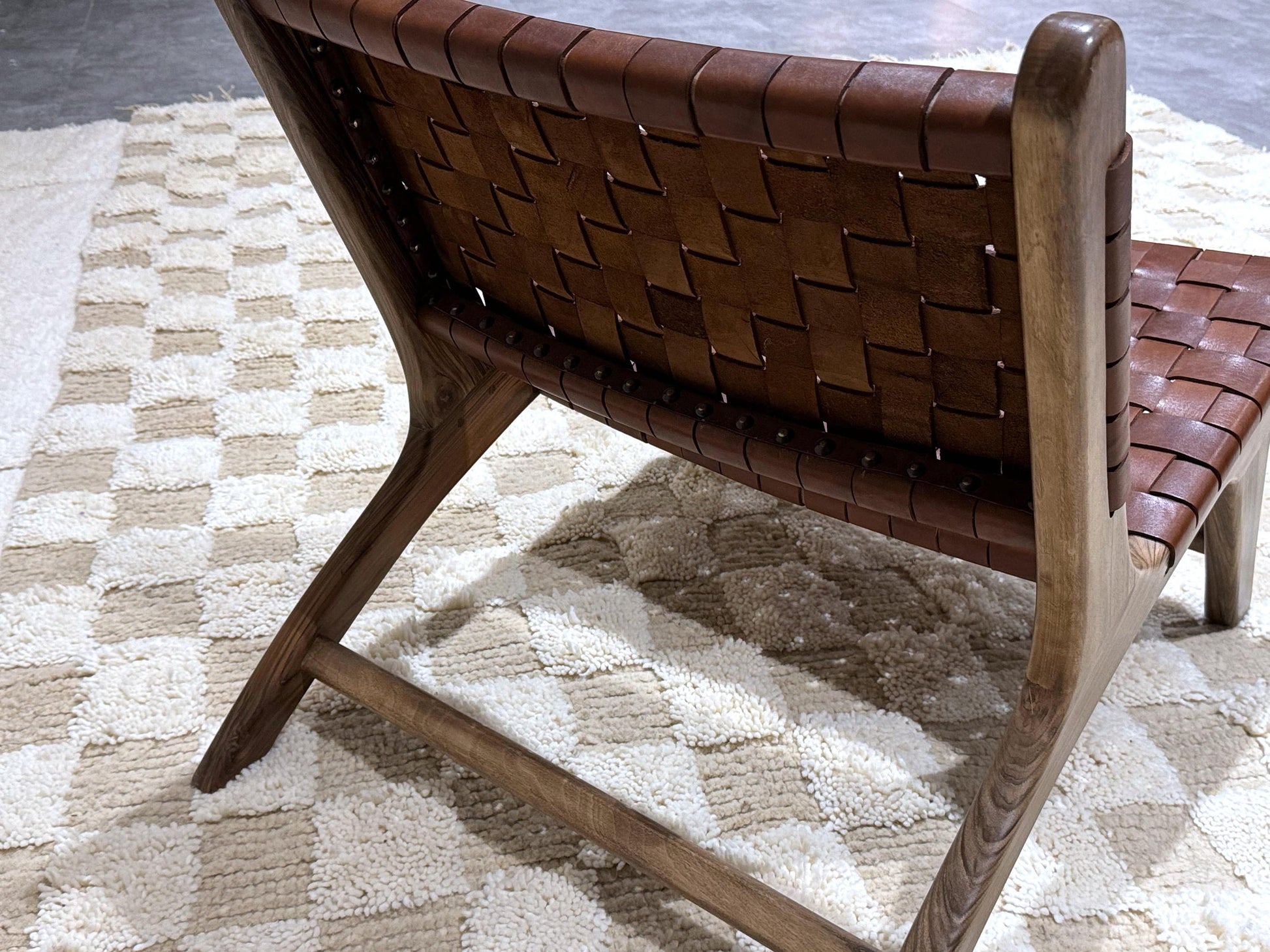 Handmade Moroccan leather woven chair placed