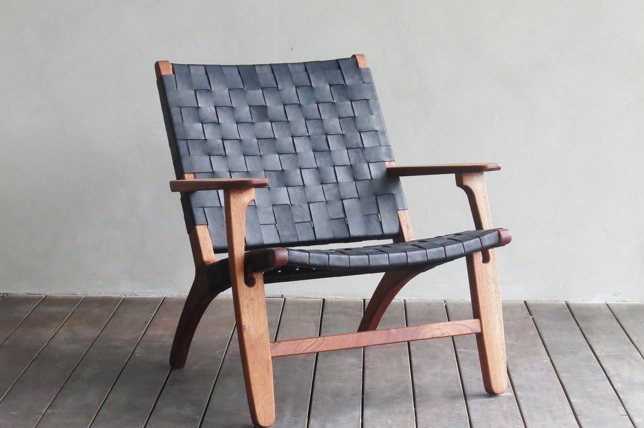 Handmade leather strap chair designed for rustic luxury living room interiors 