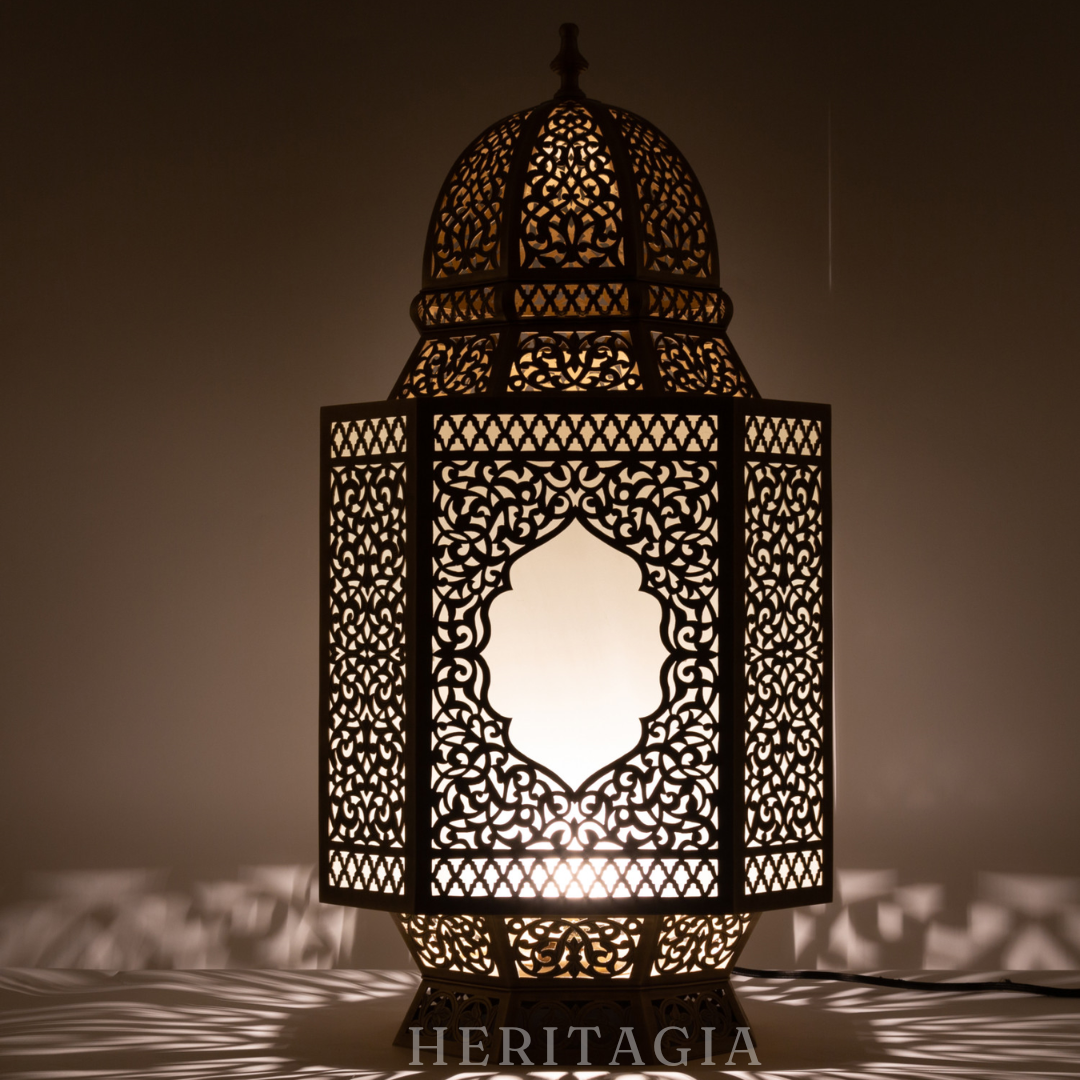 Handmade Moroccan glass lantern with brass detail for luxury home decor 
