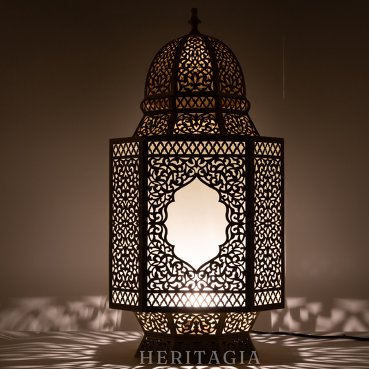 Handmade Moroccan glass lantern with brass detail for luxury home decor 
