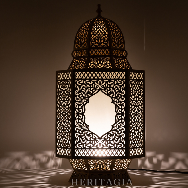 Handmade Moroccan glass lantern with brass detail for luxury home decor 
