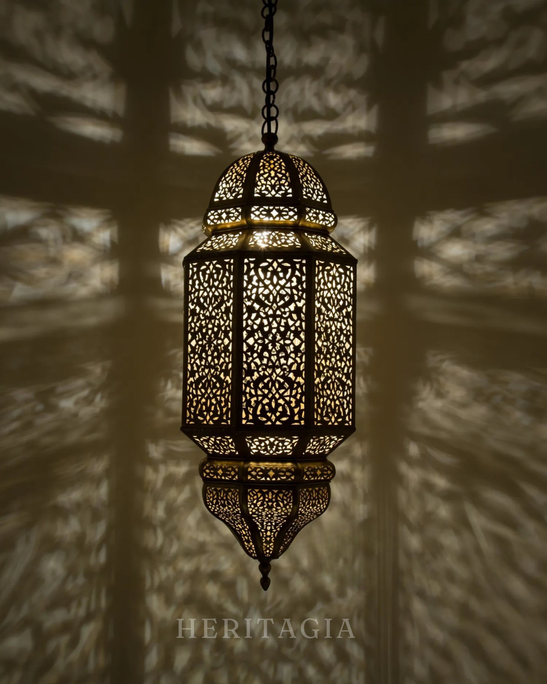 Handmade Moroccan hanging lamp with intricate cutout pattern for luxury interiors 