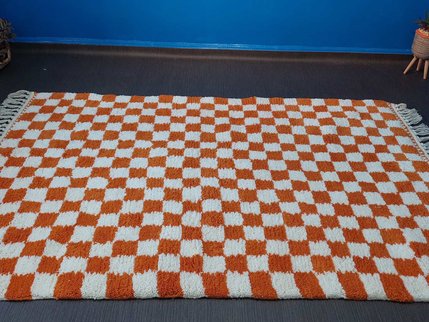 Handmade orange and white Moroccan rug designed for boho and eclectic interiors