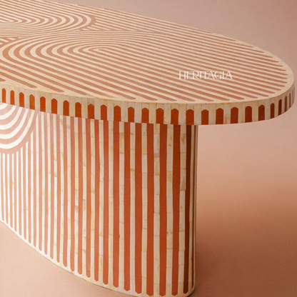 Handmade oval dining table featuring striped bone inlay design and artisan detail 