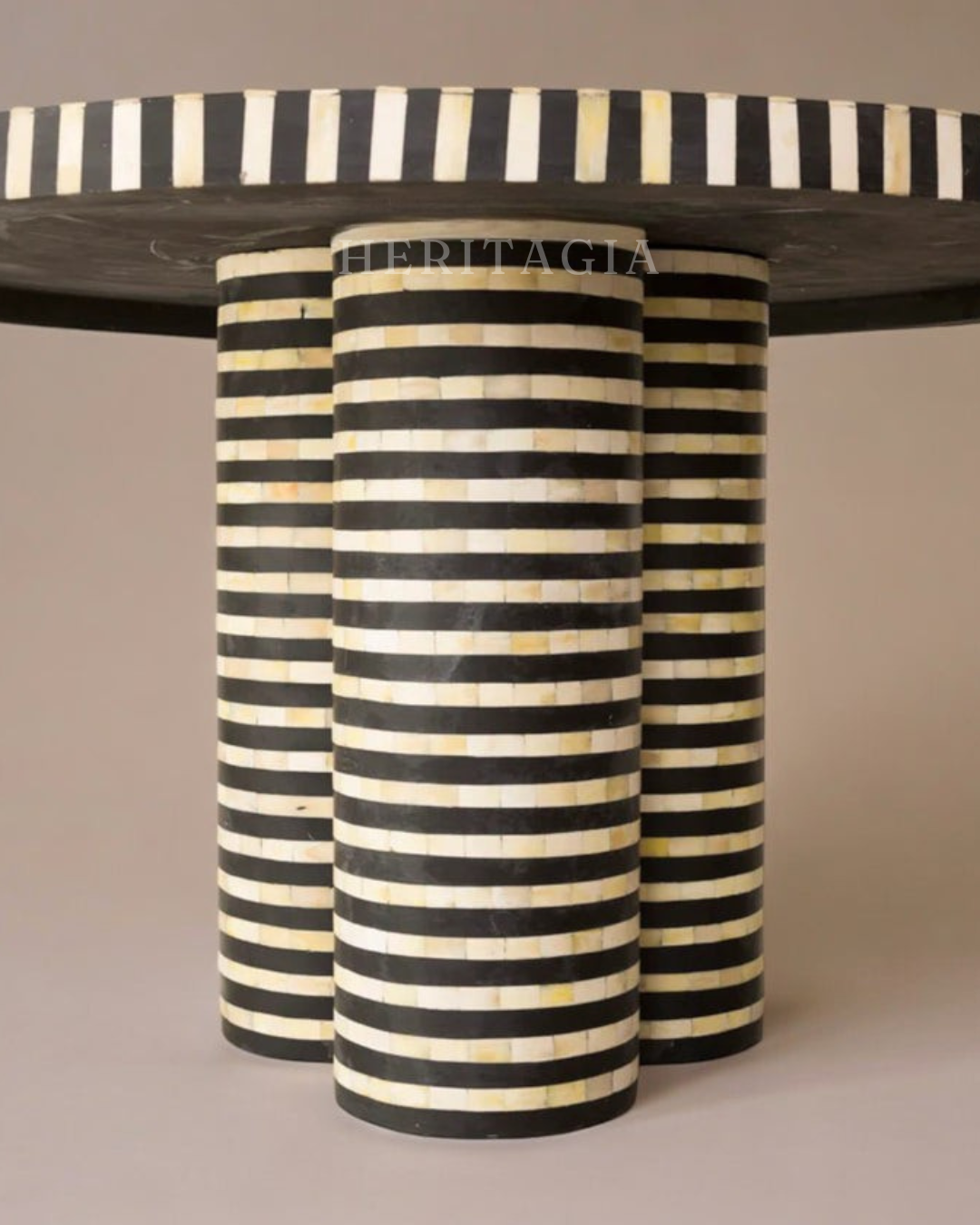 Handmade round bone inlay table with striking striped pattern 