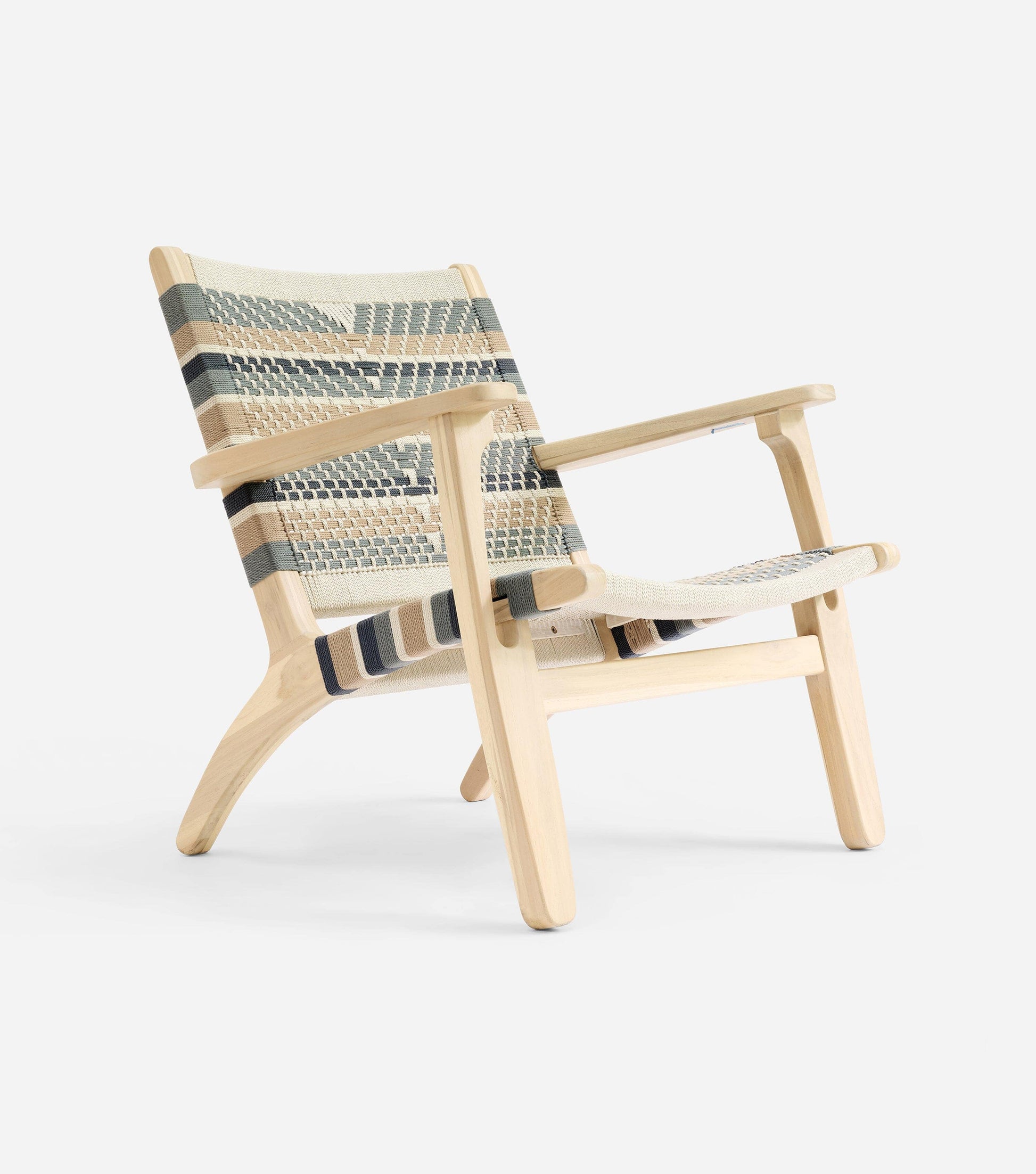 Handmade woven armchair with natural wood frame and soft neutral pattern 