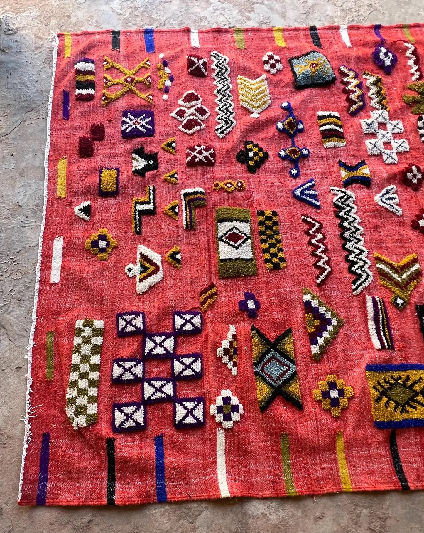Handwoven red Berber flatweave rug with bold artisan patterns