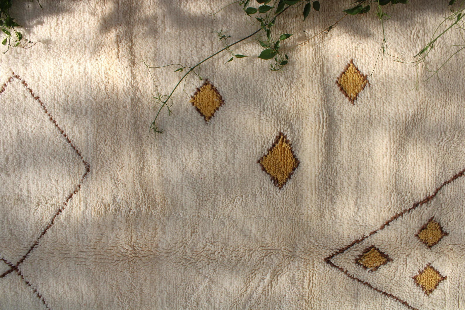 Large Beni Ourain rug styled for cozy living room and bedroom decor