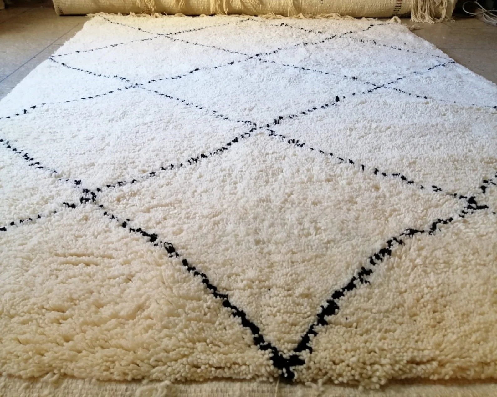 Luxury handmade Berber rug adding warmth and texture to bedroom decor