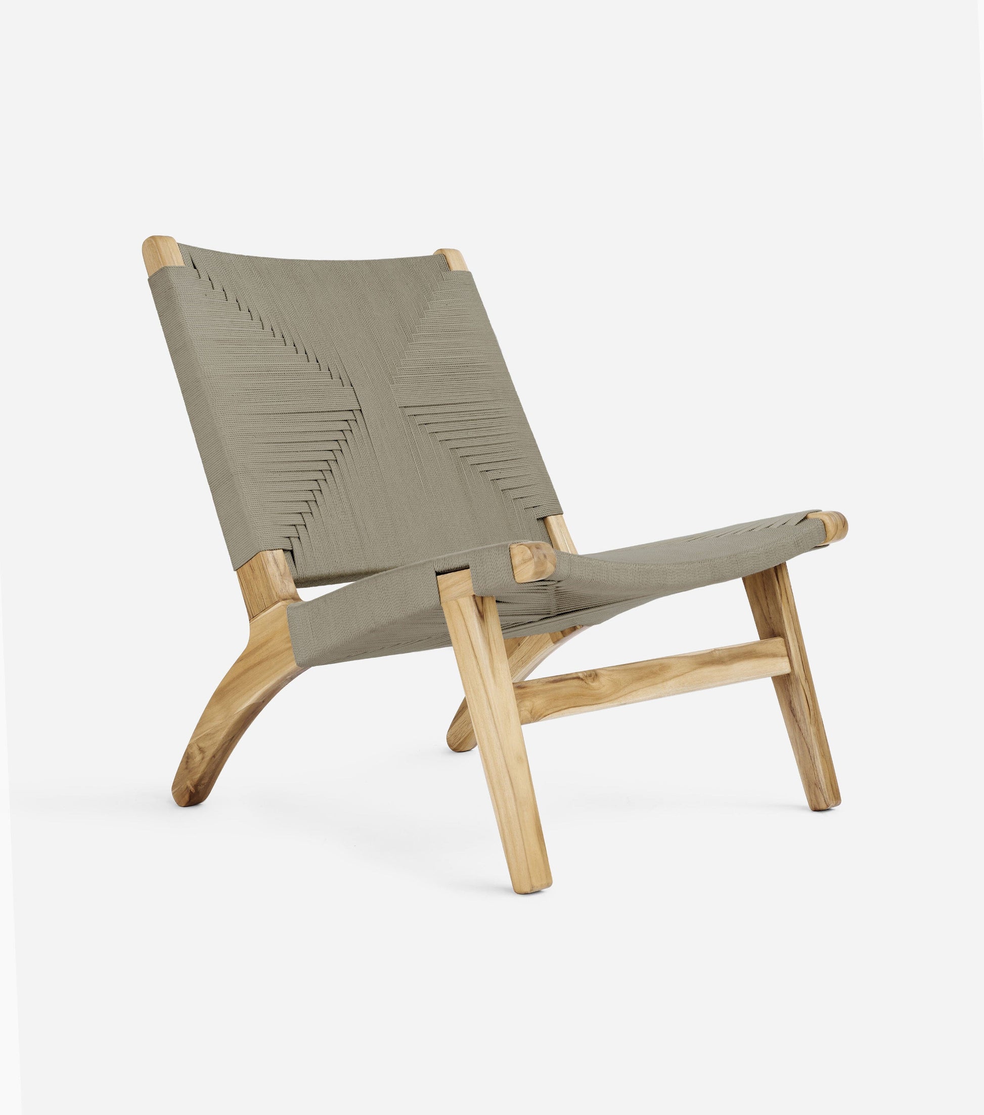 Modern boho woven chair with natural wooden frame and relaxed low profile shape