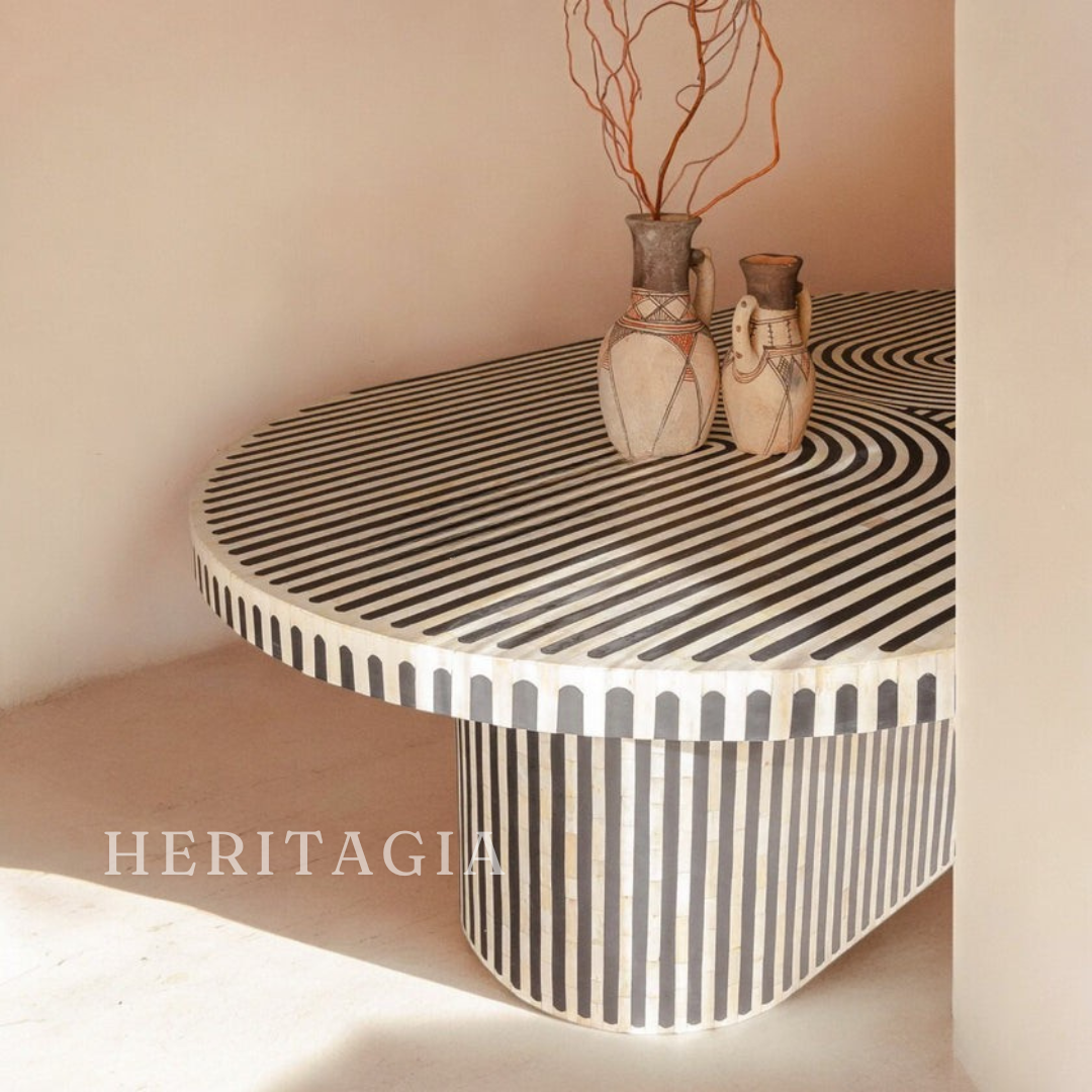 Monochrome oval dining table made with bone resin and wood