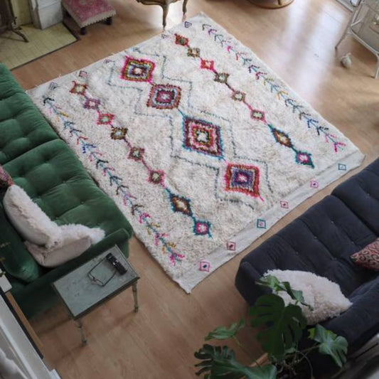 Moroccan white wool rug with colorful diamond patterns for living room decor
