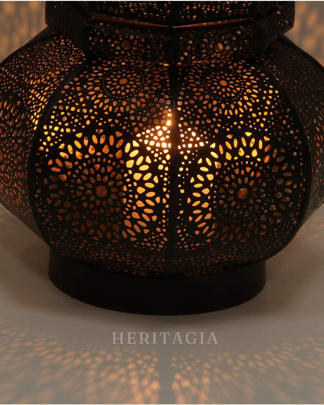 Oriental black metal bedside lamp with E27 socket and decorative pierced design 