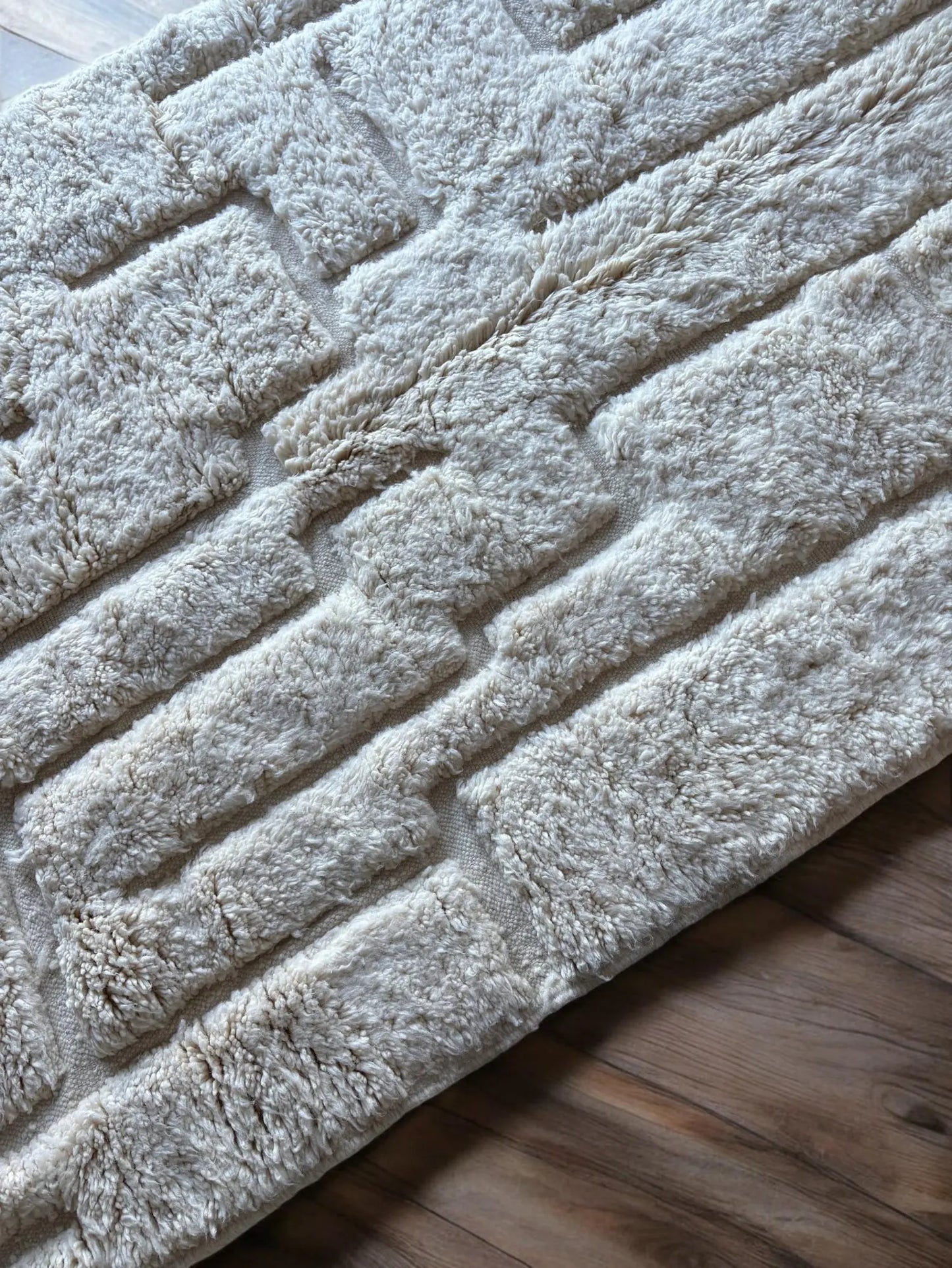 Plush white Moroccan rug adding calm texture to neutral home interiors