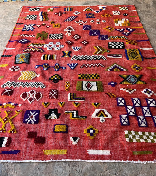 Red Moroccan Kilim rug with colorful Berber symbols and geometric embroidery