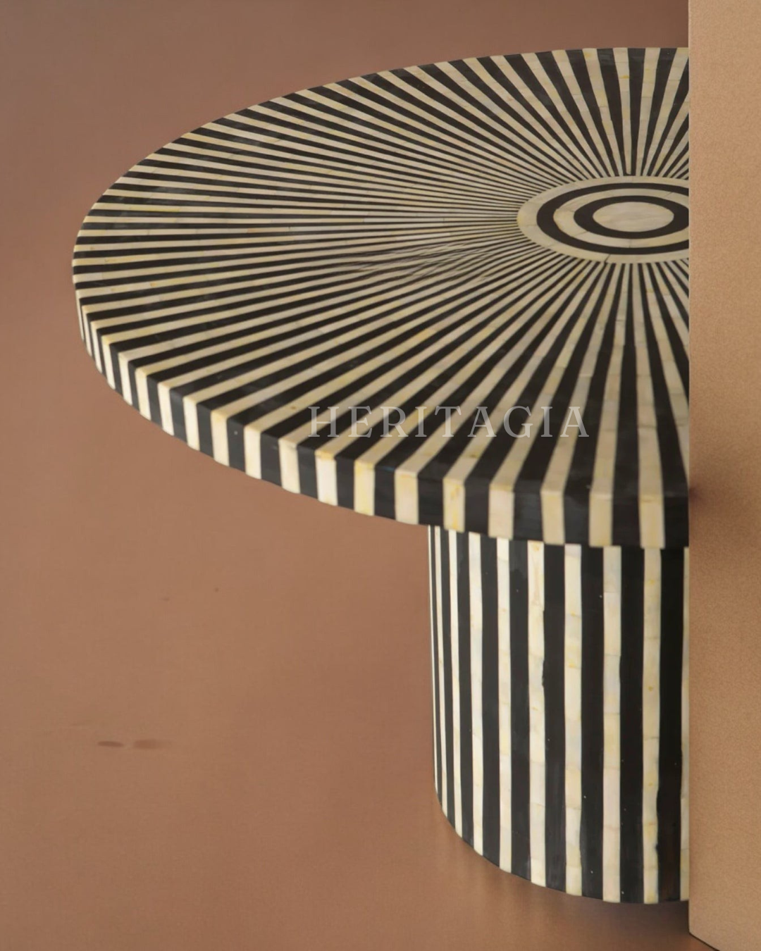 Round black and white inlay coffee table with bold circular pattern 