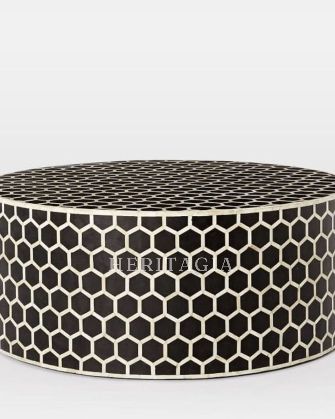 Round honeycomb coffee table styled in a modern living room