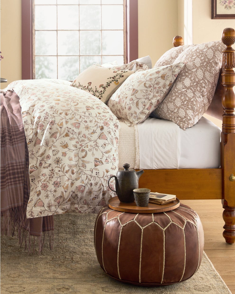 Shared view — brown pouf styled beside a bed; example colour and filled styling